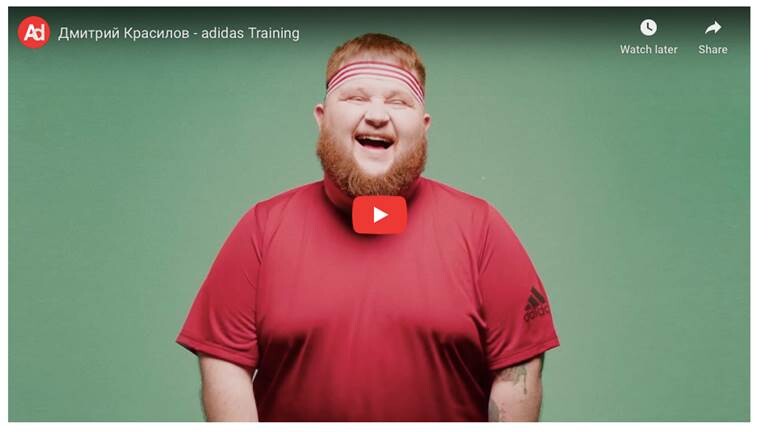 A person in a green shirt Description automatically generated